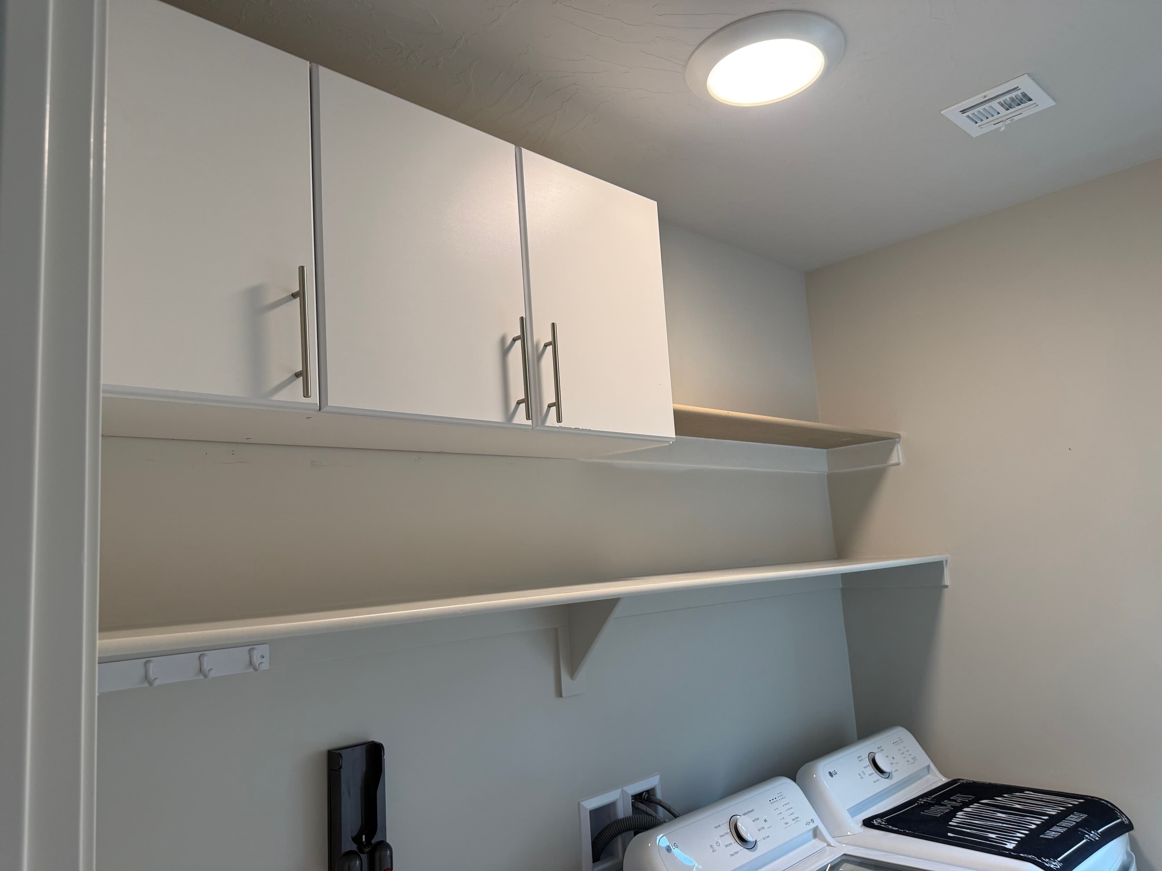 Project Laundry Room Storage Upgrade with Shelving and Cabinets image