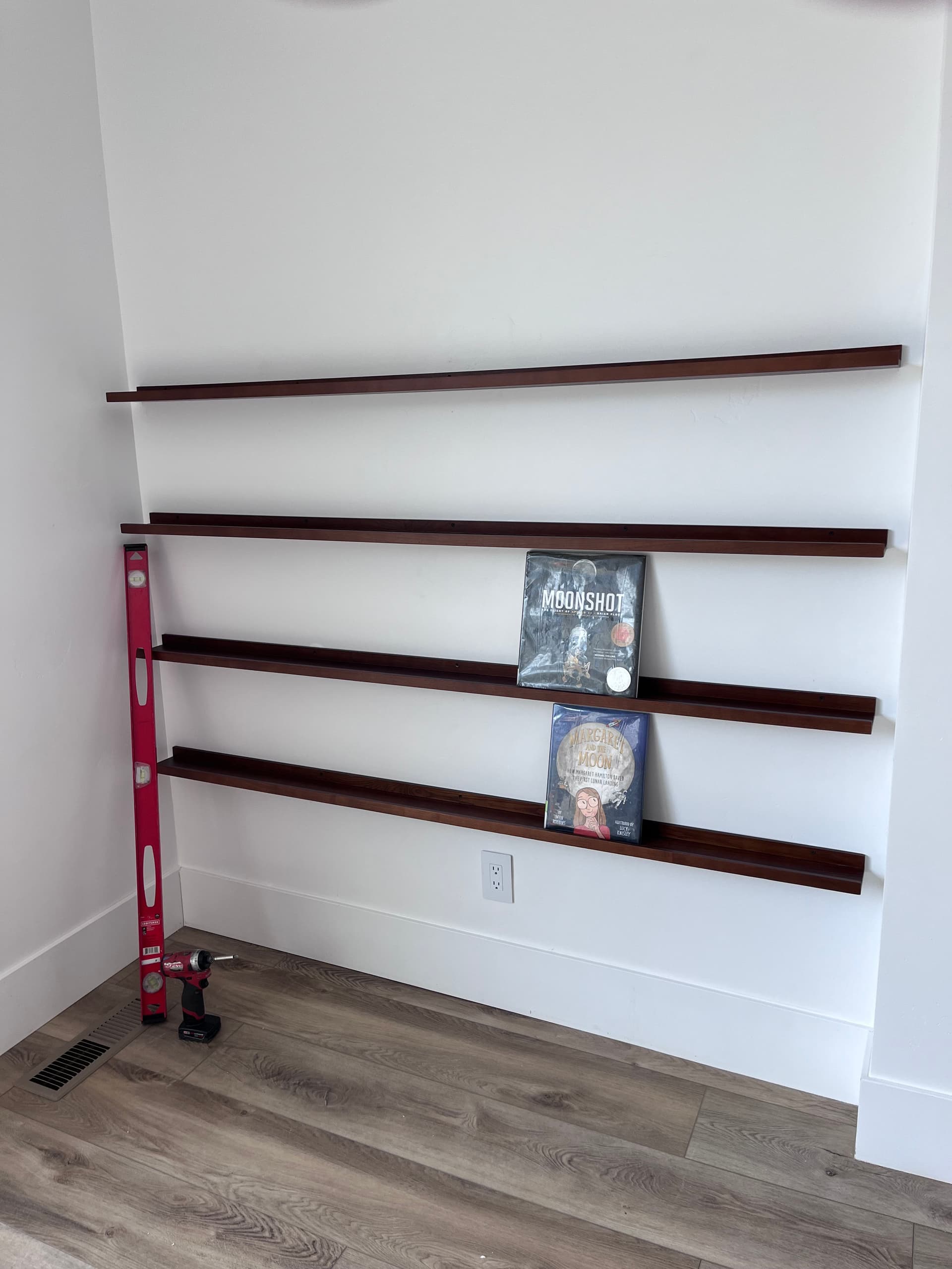 Gallery photos for Floating Shelves Turned a Blank Wall Into a Kids Home Library: Image #1
