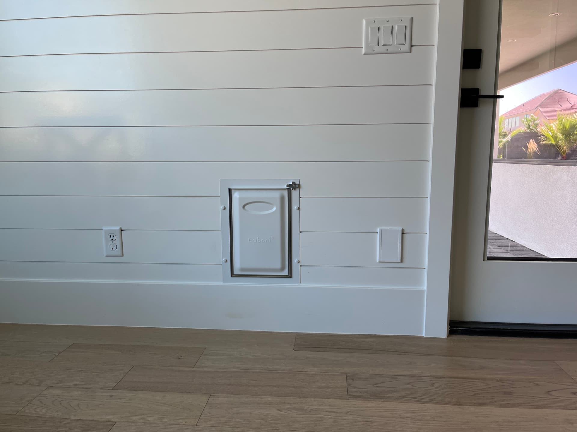 Dog Door Installation Through an Interior Shiplap Wall image